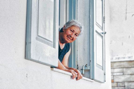 elderly looking out the window
